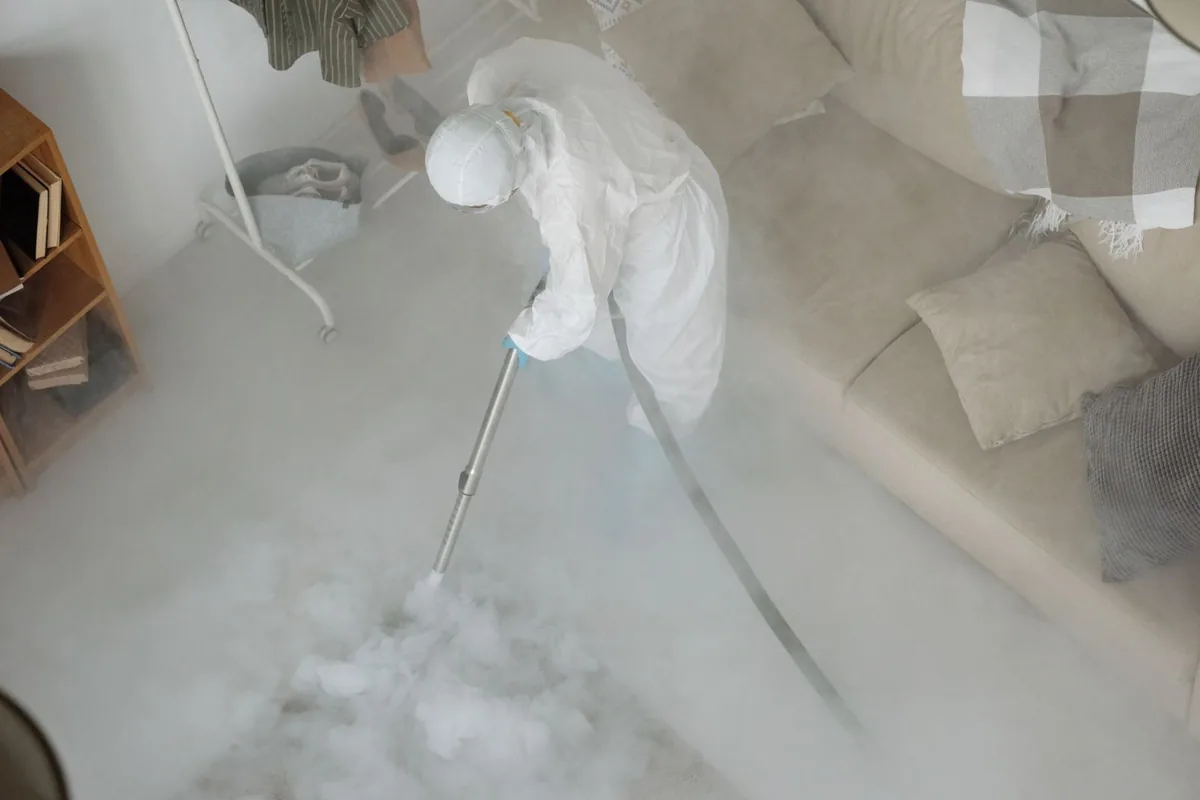 Biohazard cleanup technician in protective equipment, Dalton, OH